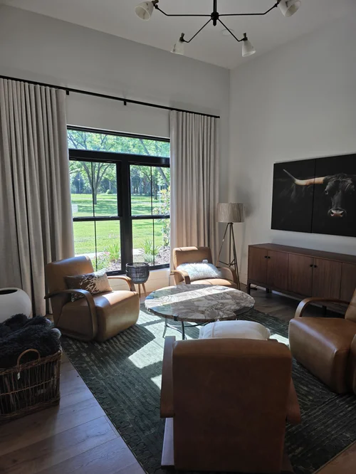 Drapery with Leather Seating, Tailored drapery framing a sitting area with leather armchairs, coordinated as one considered design. By Custom Fabric Creations, St. Petersburg, FL.