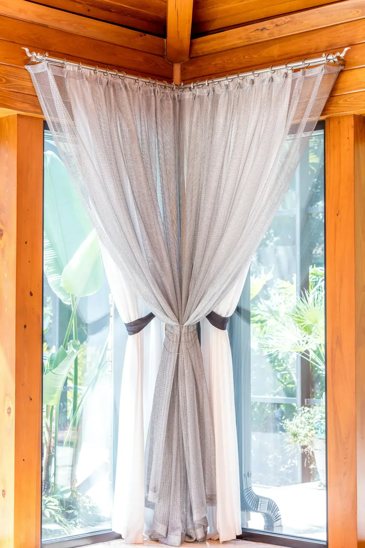 Corner Window Sheers, White sheers with a grey overlay gathered at the corner, on separate rods for a two-wall window. By Custom Fabric Creations, St. Petersburg, FL.