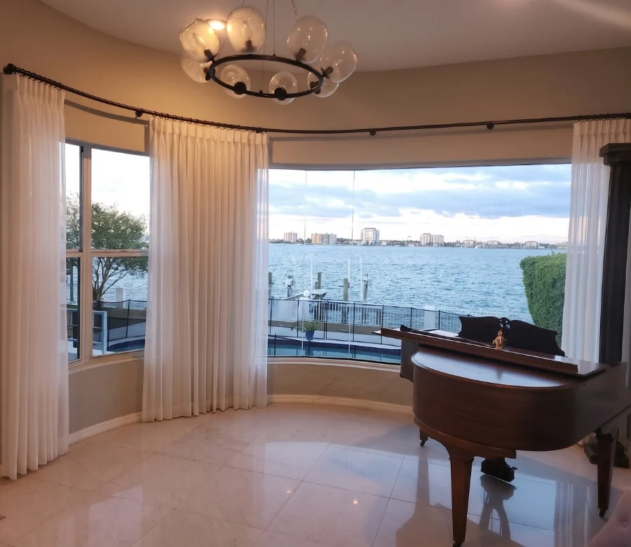 Drapery Hardware, Decorative rods, concealed tracks, and finials selected to match the home and carry the weight of full panels. By Custom Fabric Creations, St. Petersburg, FL.